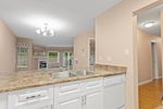 kitchen-counter-to-living-rm at 110 - 1220 Lasalle Place, Canyon Springs, Coquitlam