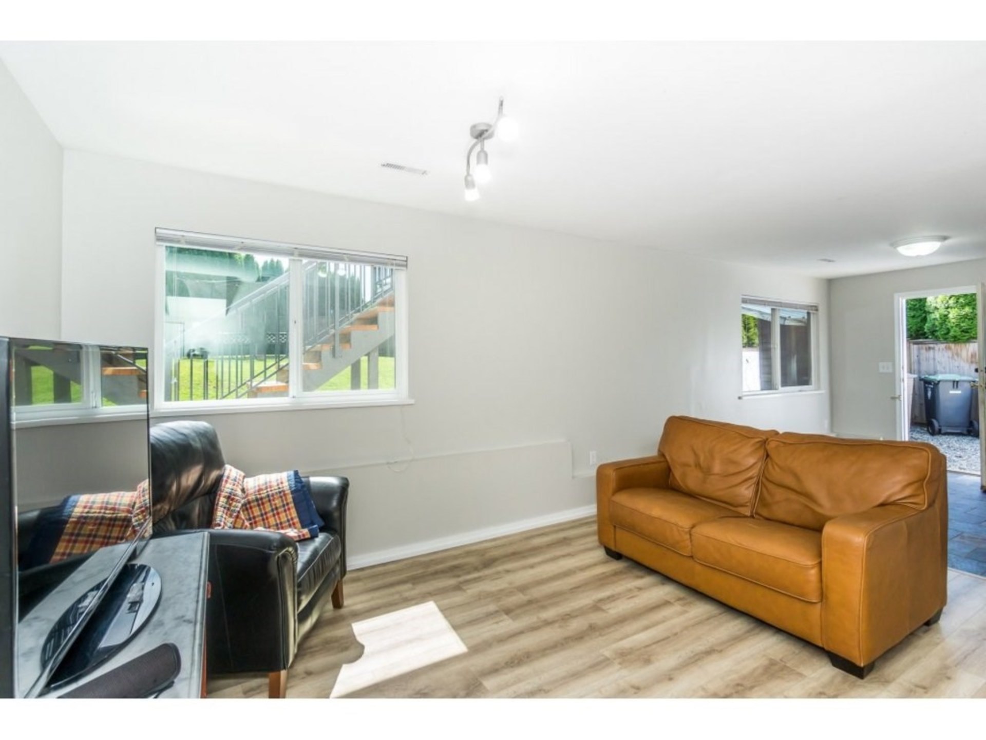 Downstairs Family Room with Exterior Door  at 21662 50a Avenue, Murrayville, Langley