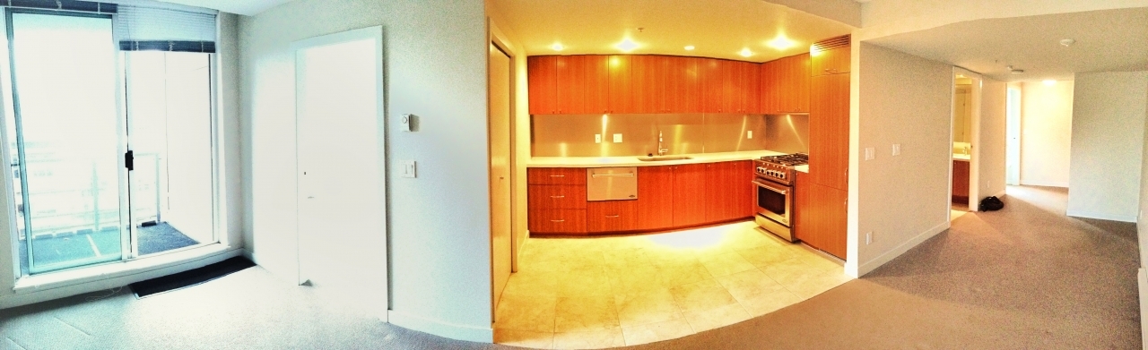 Panorama of patio, kitchen, living rm