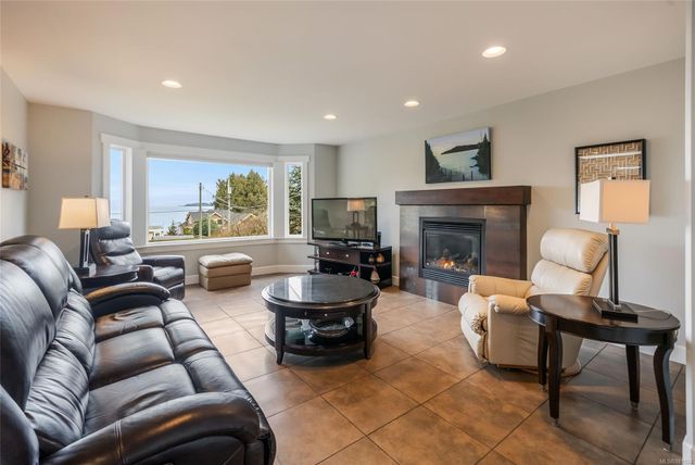 Living Area with Fireplace at 1567 Haida Way, Nanoose, Parksville/Qualicum