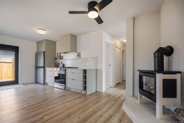 Fireplace/Kitchen at 747 Camas Way, Parksville, Parksville/Qualicum