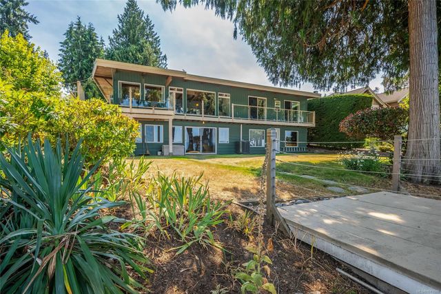 Rear Exterior with Lawn at 1558 Haida Way, Nanoose, Parksville/Qualicum