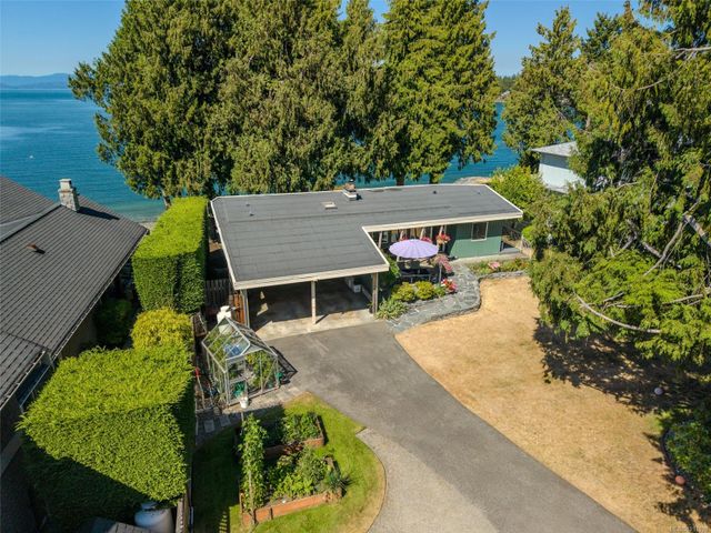 Aerial View of Home and Ocean at 1558 Haida Way, Nanoose, Parksville/Qualicum