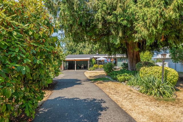 View down Driveway toward House at 1558 Haida Way, Nanoose, Parksville/Qualicum