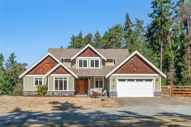 Front View of House with Woods at Rear at 1075 Cinnamon Sedge Way, Nanoose, Parksville/Qualicum Front View of House with Woods at Rear at 1075 Cinnamon Sedge Way, Nanoose, Parksville/Qualicum