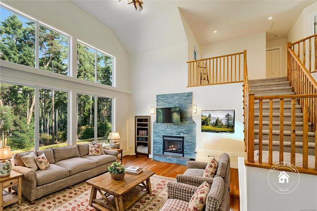 Cosy Living Area with Fireplace at 1075 Cinnamon Sedge Way, Nanoose, Parksville/Qualicum Cosy Living Area with Fireplace at 1075 Cinnamon Sedge Way, Nanoose, Parksville/Qualicum