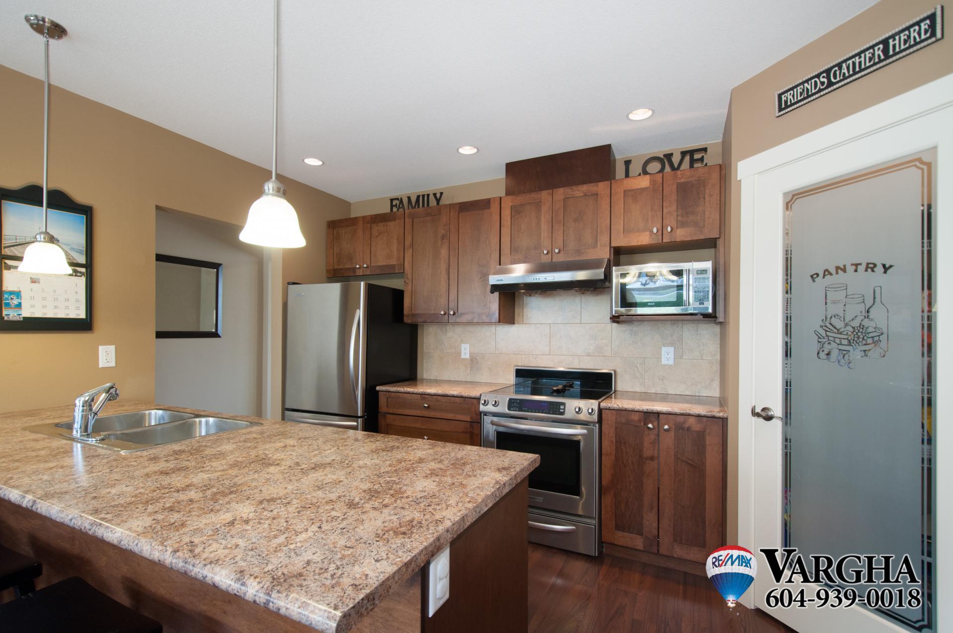 Kitchen with Large Island and Stainless Steel appliances