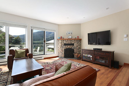 living area with fireplace at 3135 St. Moritz Crescent, Blueberry Hill, Whistler